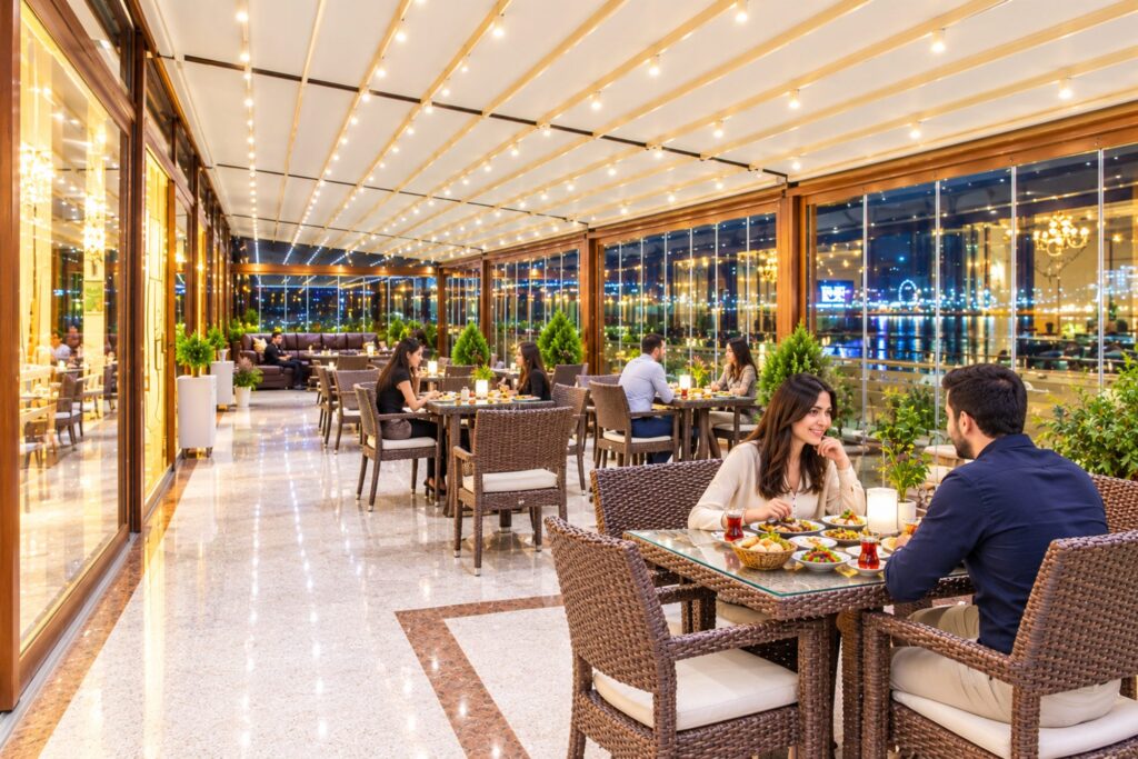 Restaurant by the windows at Modern Hotel Baku